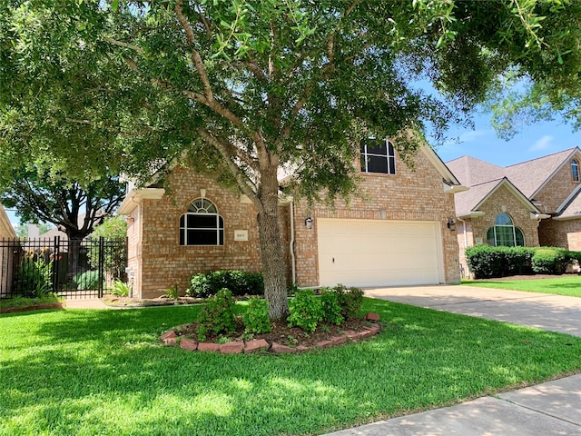 view of front of house with a front lawn and a garage