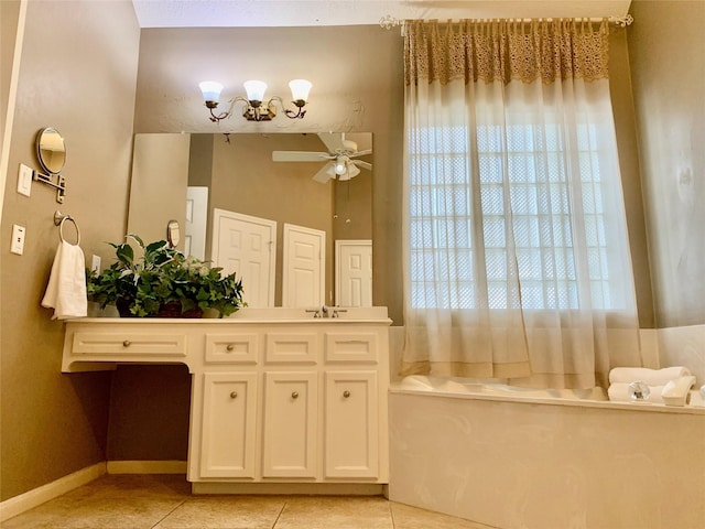 bathroom featuring tile patterned flooring, vanity, ceiling fan, and a bathing tub