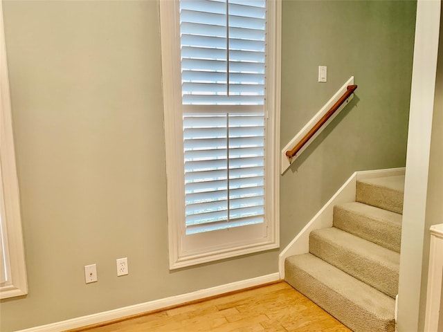 stairway featuring hardwood / wood-style flooring