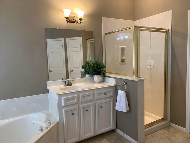 bathroom featuring tile patterned flooring, vanity, and independent shower and bath