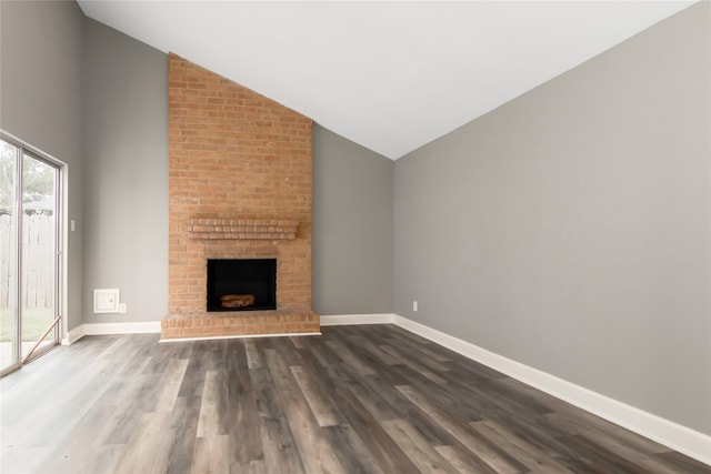 unfurnished living room featuring a fireplace, hardwood / wood-style floors, and a wealth of natural light