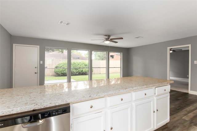 kitchen with stainless steel dishwasher, ceiling fan, dark hardwood / wood-style floors, and light stone counters