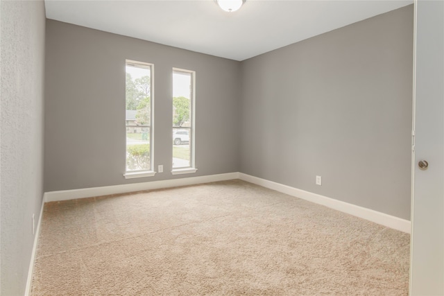 empty room with carpet flooring