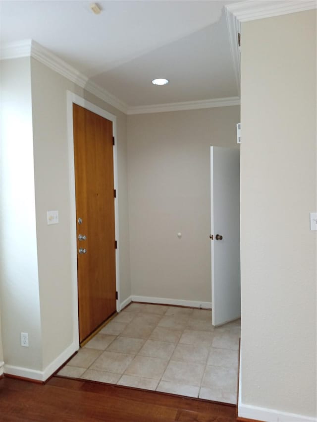 hall featuring light hardwood / wood-style floors and crown molding