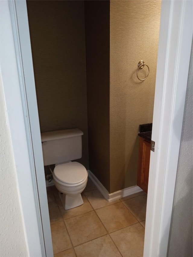 bathroom featuring toilet and tile patterned floors