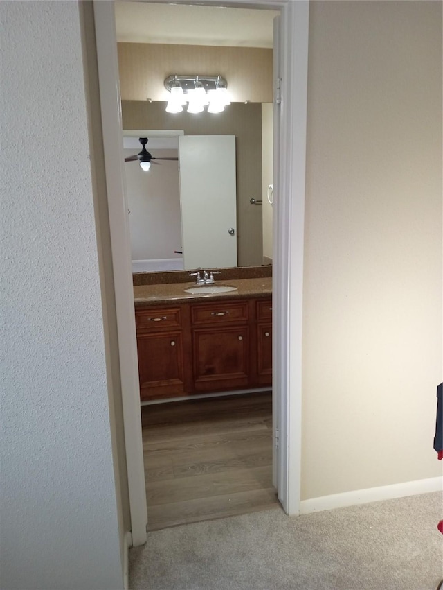 bathroom with vanity and ceiling fan