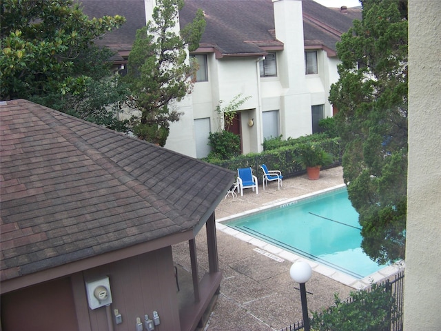 view of swimming pool featuring a patio area