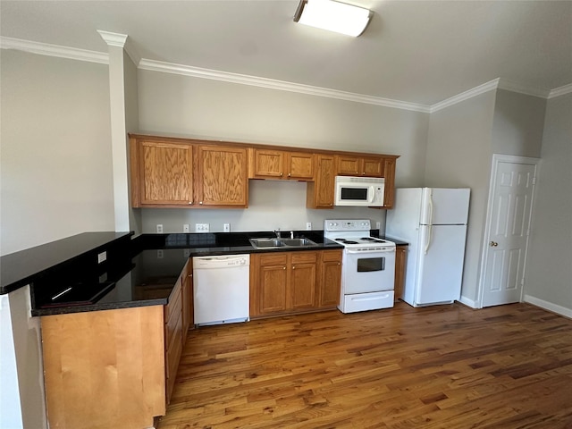 kitchen featuring crown molding, sink, dark hardwood / wood-style floors, and white appliances