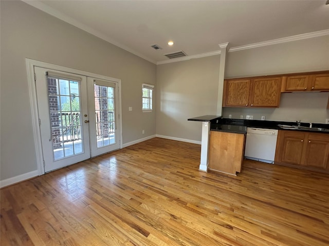 kitchen featuring french doors, ornamental molding, white dishwasher, sink, and light hardwood / wood-style floors