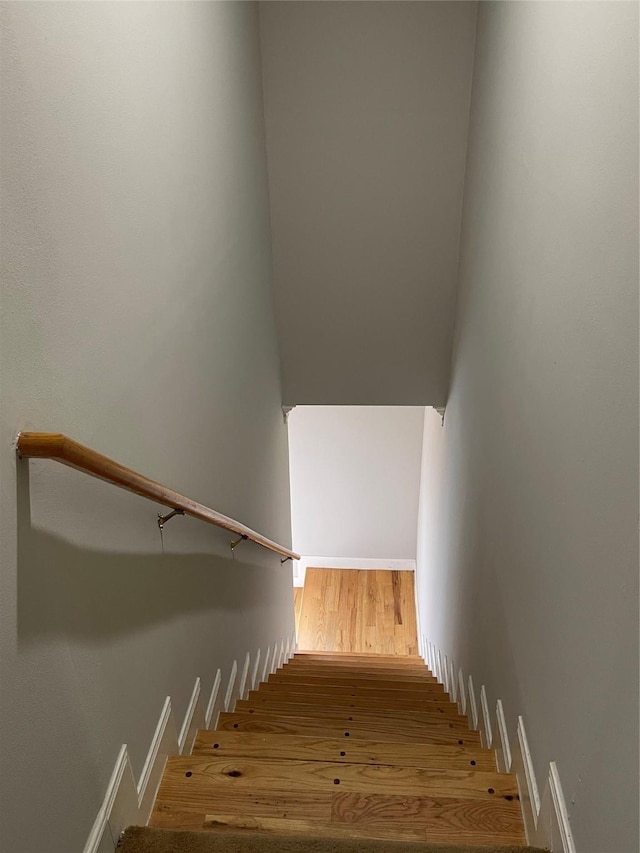 stairway featuring hardwood / wood-style flooring