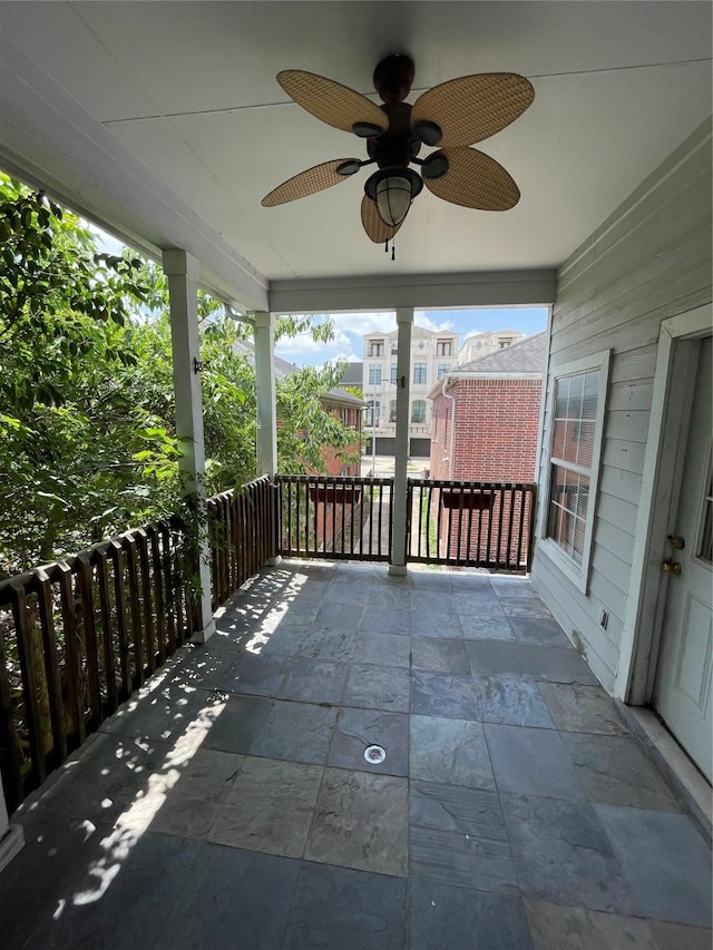 view of patio featuring ceiling fan