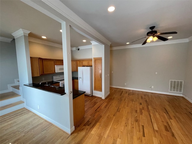 kitchen featuring white appliances, light hardwood / wood-style flooring, ceiling fan, and ornamental molding