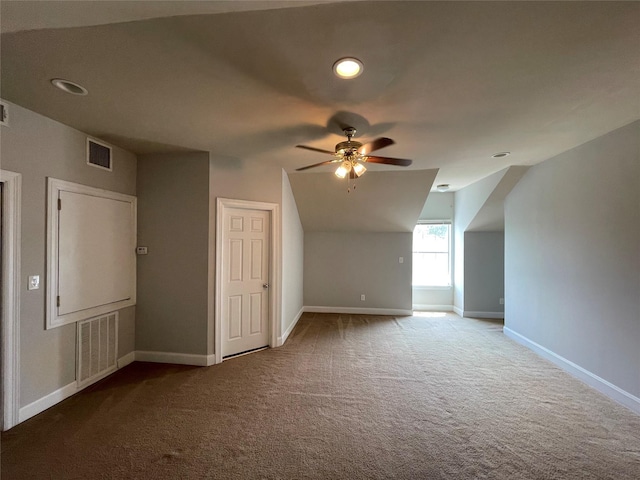 bonus room featuring ceiling fan, carpet floors, and vaulted ceiling