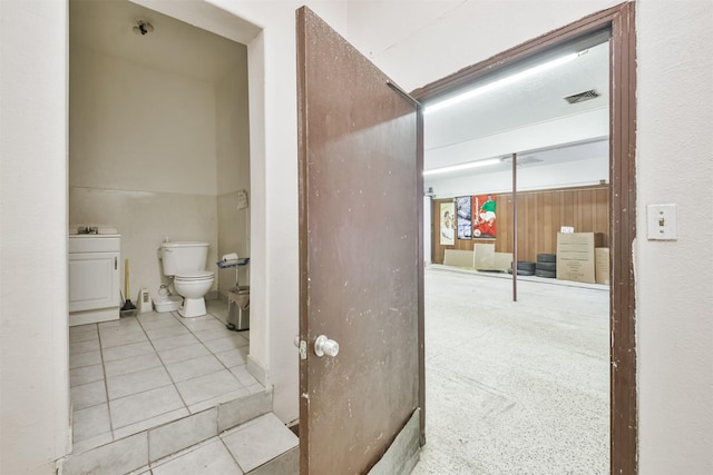 bathroom with tile patterned floors and toilet