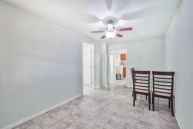 unfurnished dining area with ceiling fan