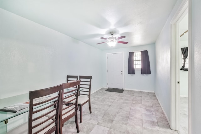 dining room featuring ceiling fan