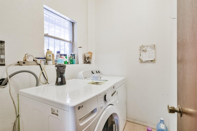 washroom with washer and dryer