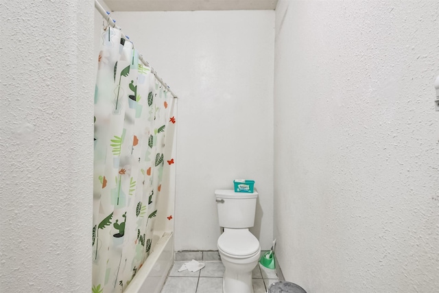 bathroom featuring tile patterned floors, shower / bathtub combination with curtain, and toilet