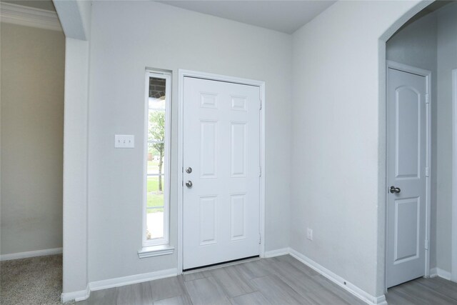 entrance foyer featuring a wealth of natural light and light wood-type flooring