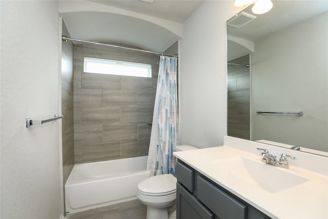 full bathroom with vanity, toilet, hardwood / wood-style flooring, and shower / bath combination with curtain