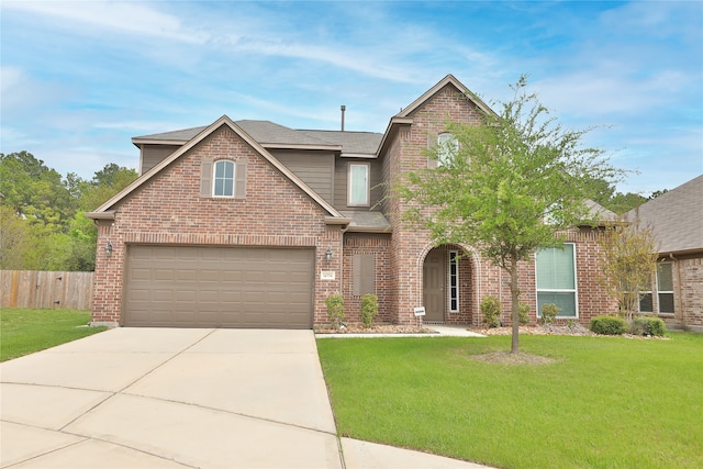 front of property with a garage and a front lawn