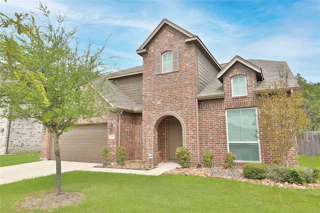 view of front of home with a front lawn and a garage