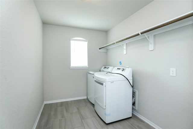 laundry room featuring washing machine and dryer