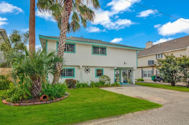 view of front of house featuring a front yard and a carport