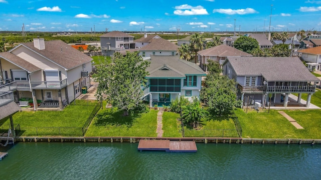 drone / aerial view with a water view