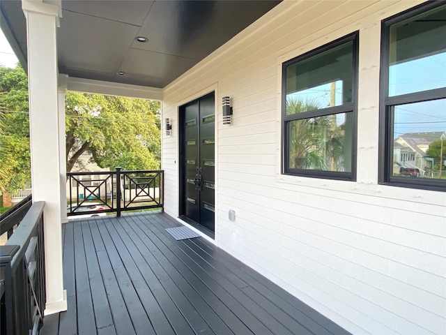 wooden terrace featuring a porch