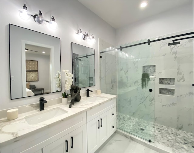 bathroom featuring vanity and an enclosed shower