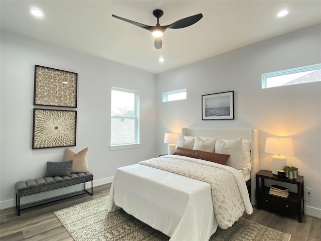 bedroom featuring hardwood / wood-style floors and ceiling fan