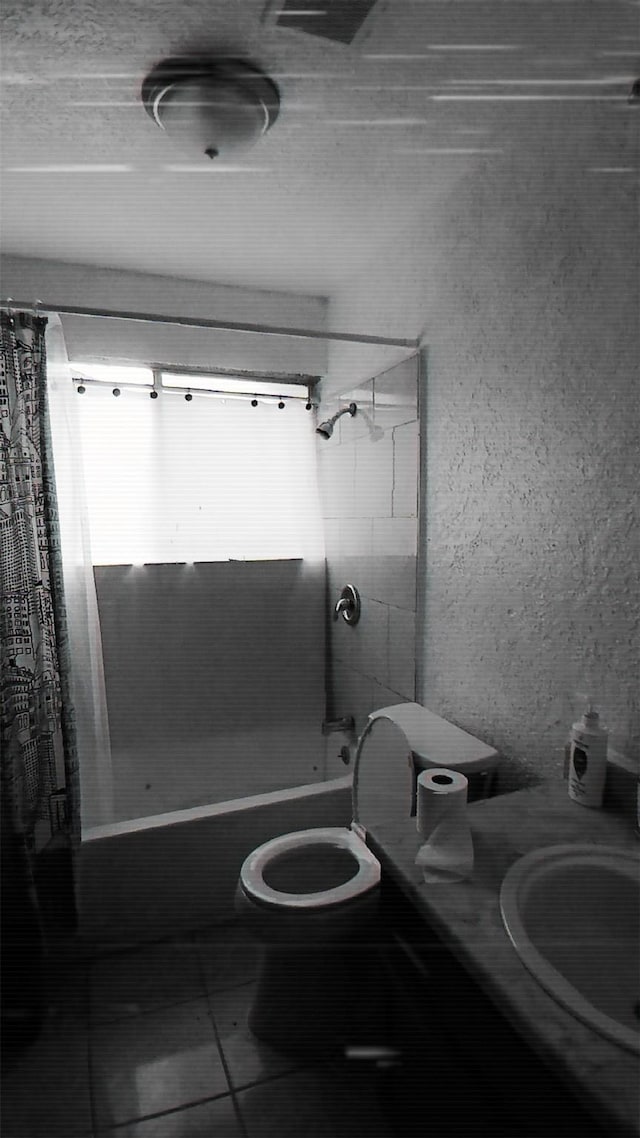 full bathroom with tile patterned flooring, vanity, toilet, and shower / bathtub combination with curtain