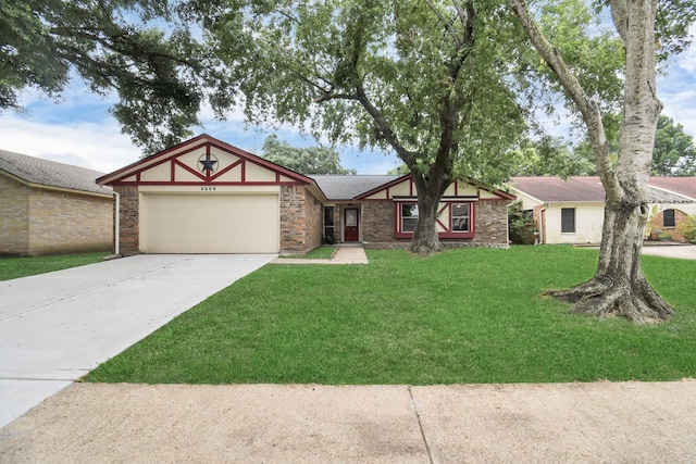 view of front of home with a front lawn and a garage