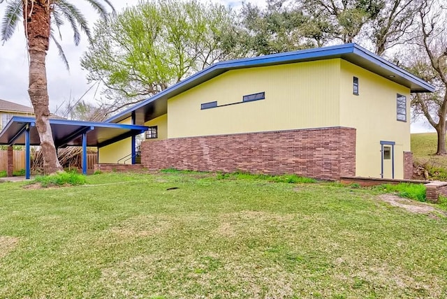 4600 Lakeshore Dr, Port Arthur, TX 77642 - view of property exterior featuring a lawn