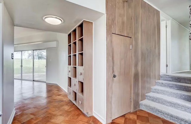 corridor with light parquet flooring