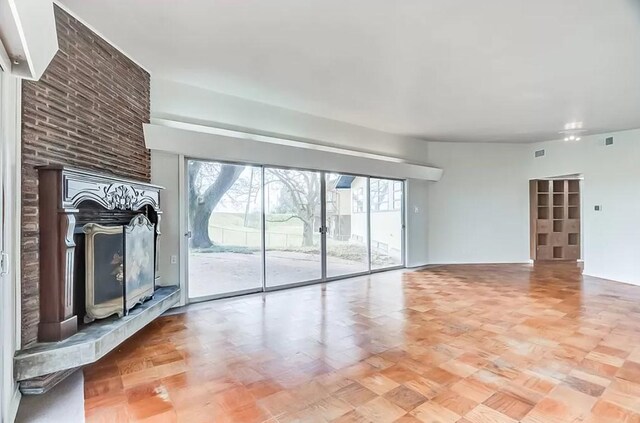 unfurnished living room featuring a fireplace