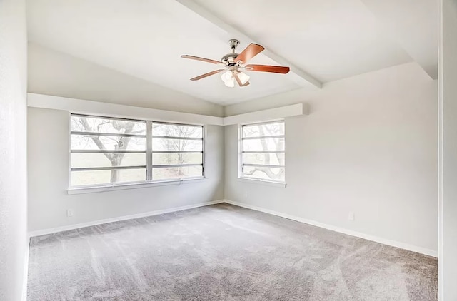 carpeted spare room with vaulted ceiling with beams and ceiling fan