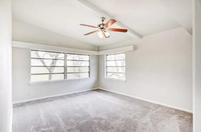 4600 Lakeshore Dr, Port Arthur, TX 77642 - carpeted empty room with vaulted ceiling with beams and ceiling fan