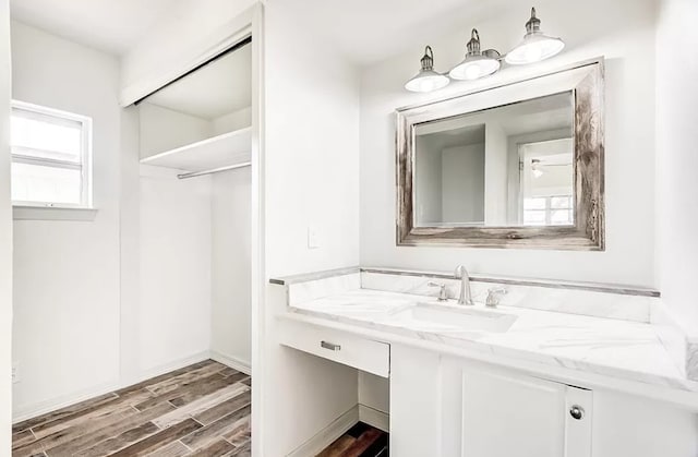 bathroom with wood-type flooring and vanity