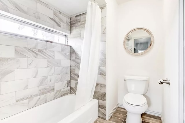 bathroom featuring toilet, shower / bath combo, and hardwood / wood-style floors