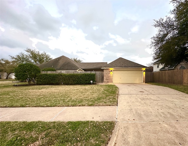 view of front facade with a garage and a front lawn