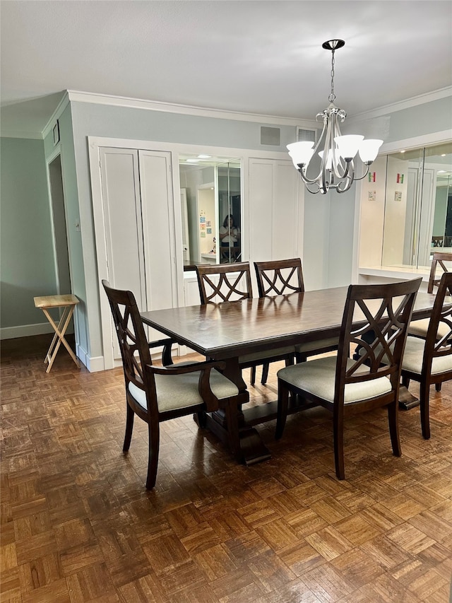 dining room featuring a notable chandelier, parquet flooring, and crown molding