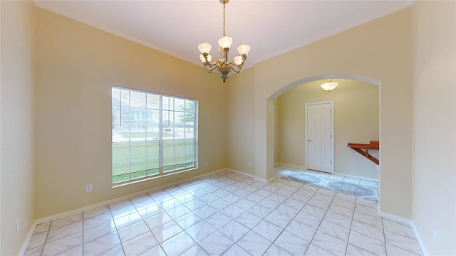 tiled empty room with a chandelier and ornamental molding