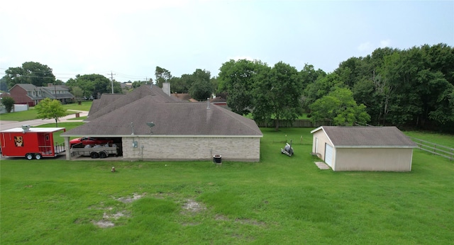 exterior space with a lawn and an outbuilding