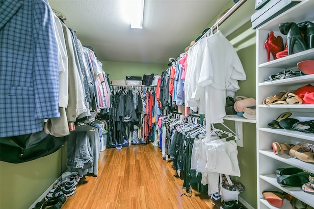 walk in closet featuring light hardwood / wood-style floors