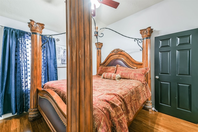 bedroom with hardwood / wood-style flooring and ceiling fan