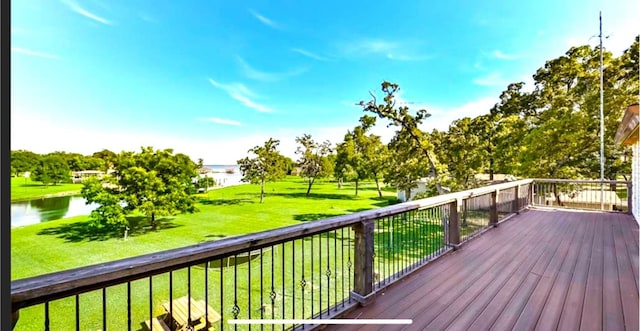 deck featuring a water view and a yard