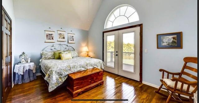 bedroom featuring dark hardwood / wood-style floors, high vaulted ceiling, access to exterior, and french doors