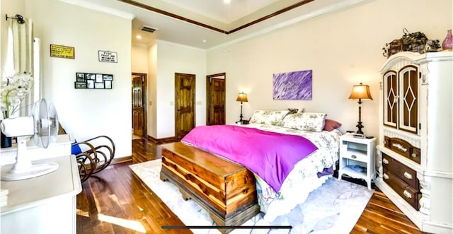 bedroom featuring ornamental molding and dark wood-type flooring